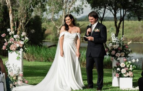 Ceremony on lawn Groom talking in microphone