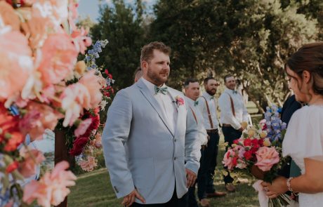 Groom greeting bride