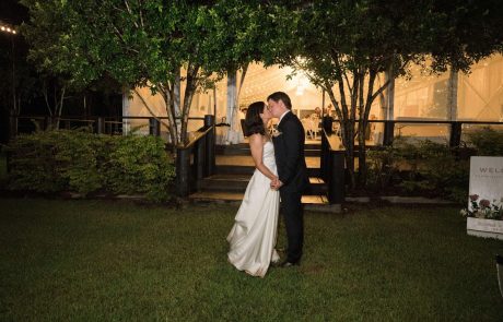 Bride and Groom kissing in front of marquee